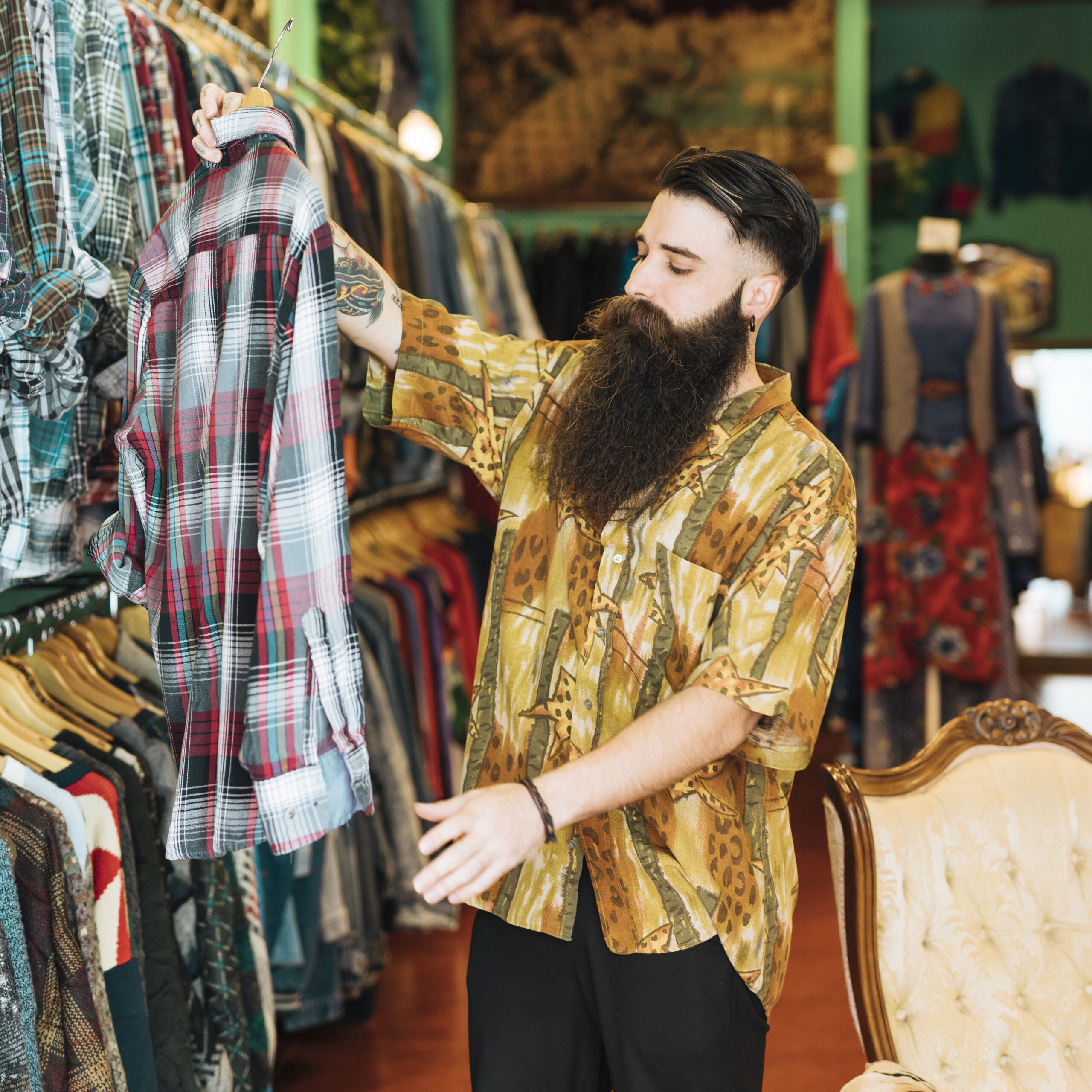 portrait bearded man looking plaid shirt clothing shop scaled.jpg
